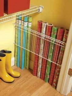 Put up a wire shelf in the dead space of a closet to corral wrapping paper. | 52 Meticulous Organizing Tips For The OCD Person In You
