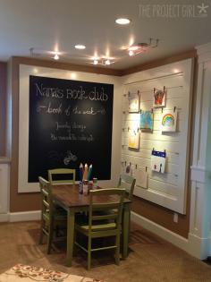 Kid's nook - love the framed chalk board and art display