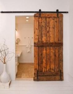 Hermosa  Cool idea to add this track door to a master bedroom as a design element, but also to add some privacy to a suite bathroom.  Even I can use one of these - great idea for bath privacy and eliminates door space!