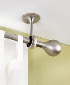 Hang curtains from the ceiling. Avoid measuring and makes ceilings look taller! >> Smart!