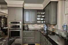 Open corner shelving and toe kick detail.  Also like the backsplash.