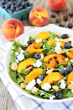 Grilled Peach, Blueberry, and Goat Cheese Arugula Salad Recipe on twopeasandtheirpo... Love this simple and beautiful summer salad! #salad #glutenfree