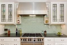 hood and shelves; sea glass subway tiles | kitchen by Jerome Buttrick via Remodelista.