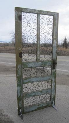 Barbed wire spirals take the place of panels and glass. It stands with the help of old, shelving brackets. great for the backyard area