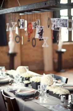 What a cute idea, at your engagement party, hang special pictures of your life with your significant other to-be for your guests to see above the table